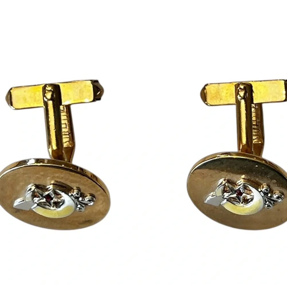 SWANK Gold and Silver Skull Earrings
